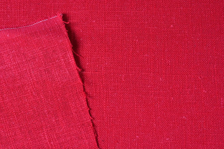 red hemp viscose natural fabric cloth color, sackcloth rough texture of textile fashion abstract backgroundの写真素材