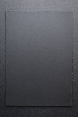 blank black notebook on shine black backgroundの写真素材
