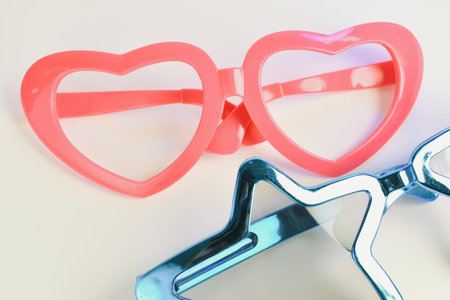 heart and star shape of glasses on old sepia backgroundの写真素材