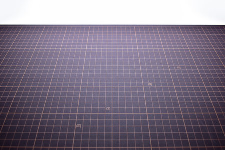 black cutting mat board on white background with line and scale measure guide pattern for object art...