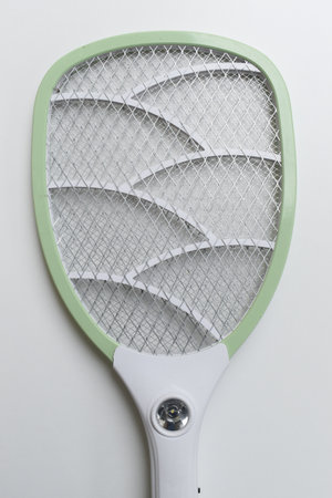 green mosquito swatter isolated on white backgroundの写真素材