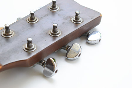 part of broken wood acoustic guitar isolated on white backgroundの写真素材