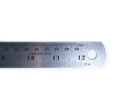 metal ruler isolated on white background, object for education