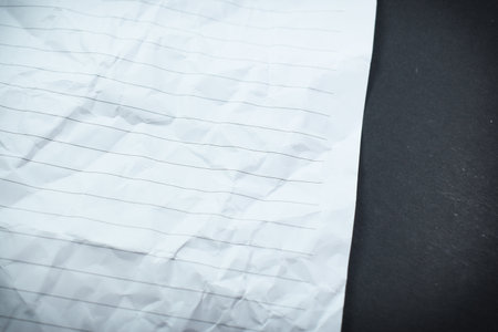 crumpled line paper texture on black background,  blank sheet notebook