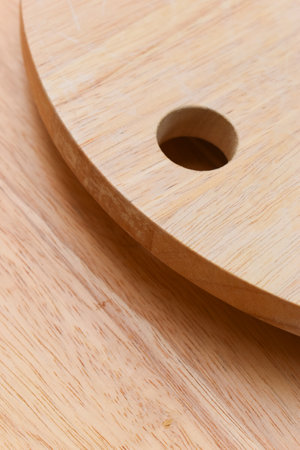 brown wooden sphere cuttingboard wood backgroundの写真素材