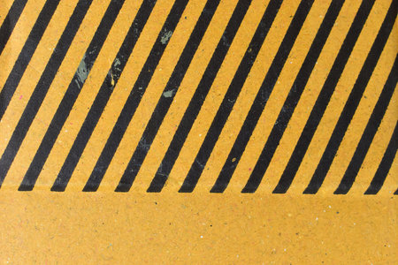 striped black and yellow cardboard box texture backgroundの写真素材