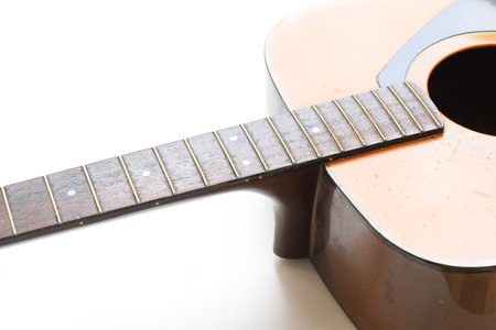 brown wood acoustic guitar isolated on white backgroundの写真素材