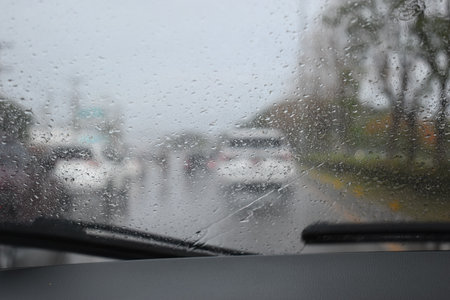 car on highway road with rainny season, blurred imageの写真素材