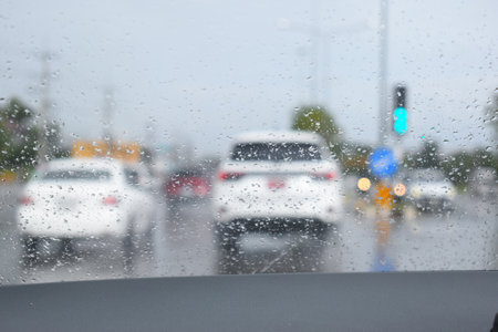 car on highway road with rainny season, blurred imageの写真素材