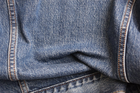 seam of blue denim texture background, jean fashion style