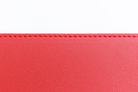 shiny red leather texture isolated on white backgroundの写真素材