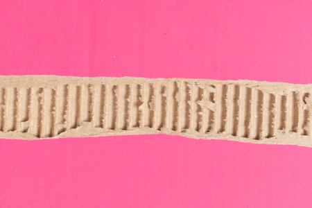 tear pink cardboard box texture background, recycle materialの写真素材