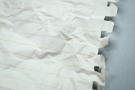 crumpled line paper texture on grey background,  blank sheet notebookの写真素材