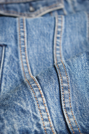 seam of blue denim texture background, jean fashion styleの写真素材