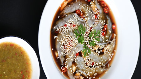 shrimp in soy sauce on white plate, korean style menuの写真素材
