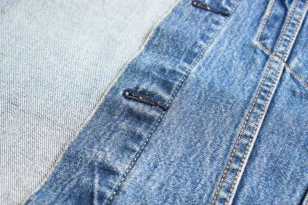 seam of blue denim texture background, jean fashion style
