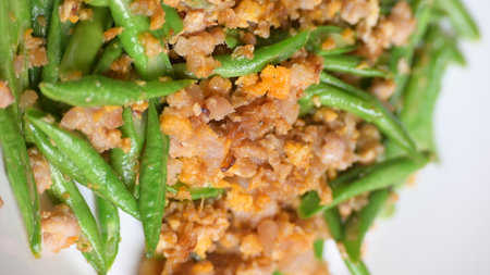 fried green bean with pork on white plate, thai and chinese food