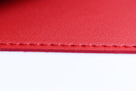 shiny red leather texture isolated on white background