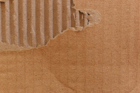 tear brown cardboard box texture background, recycle materialの写真素材