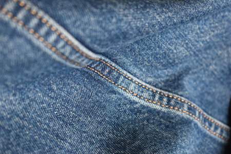 seam of blue denim texture background, jean fashion style