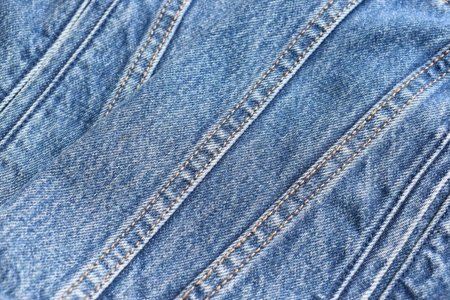 seam of blue denim texture background, jean fashion style