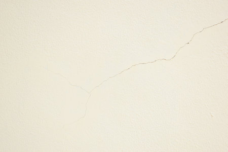crack on white wall from earthquake, construction industryの写真素材