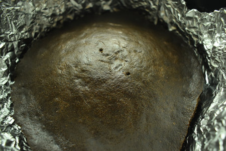 brown chocolate cake bake on aluminum foil paperの写真素材