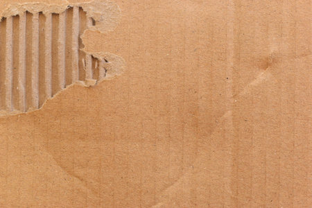 tear brown cardboard box texture background, recycle materialの写真素材