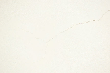 crack on white wall from earthquake, construction industryの写真素材