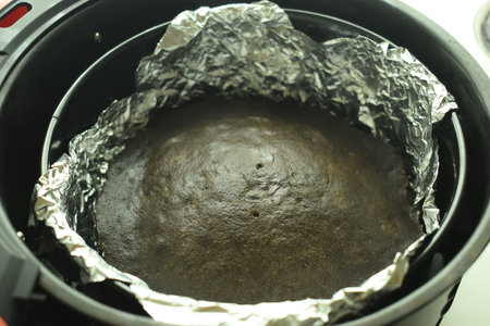 brown chocolate cake bake on aluminum foil paperの写真素材