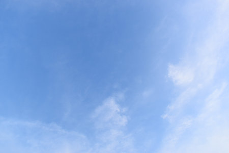 beautiful blue sky and white cloud background in springtimeの写真素材