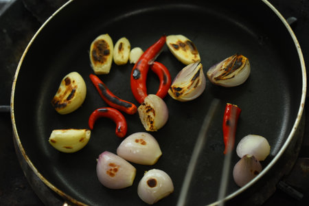 chilli and garlic burn on black pan, spicy foodの写真素材