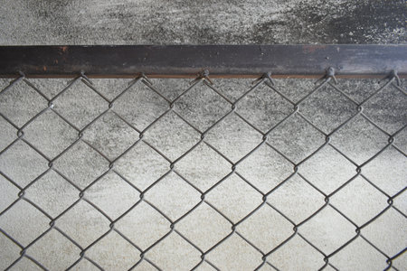 old wire mesh on dirty wall, construction industryの写真素材
