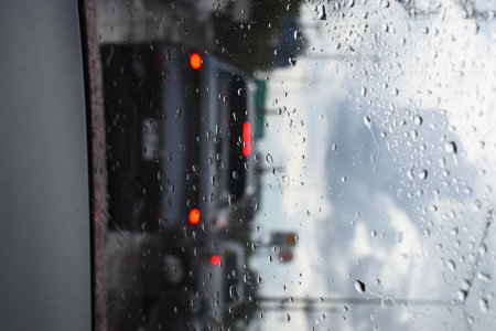 car on highway road with rainny season, blurred imageの写真素材