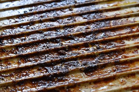 dirty white circle pan after cooking in homeの写真素材