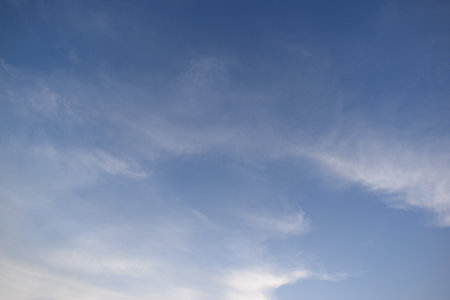beautiful blue sky and white cloud background in springtimeの写真素材