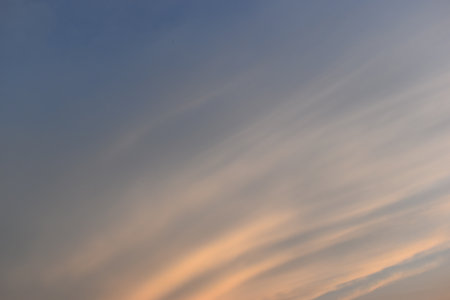 beautiful golden sky and white cloud background in springtimeの写真素材