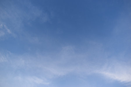 beautiful blue sky and white cloud background in springtimeの写真素材