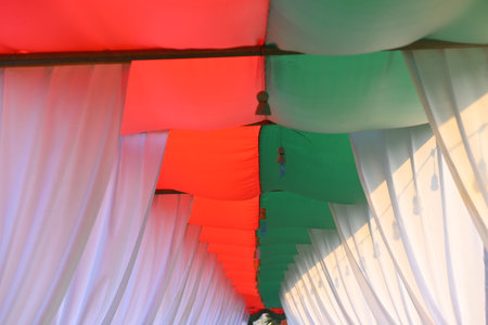 white, green and red curtain decorate for party in the gardenの写真素材