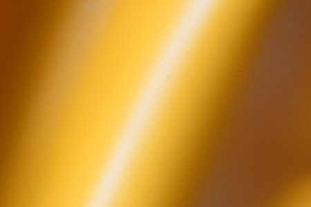 shiny yellow leather texture background for designの写真素材