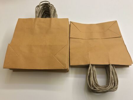 Paper shopping bags, brown paper bags with handleの写真素材