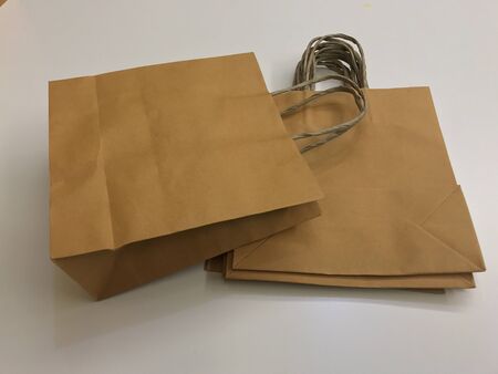 Paper shopping bags, brown paper bags with handleの写真素材