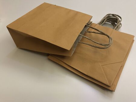 Paper shopping bags, brown paper bags with handleの写真素材