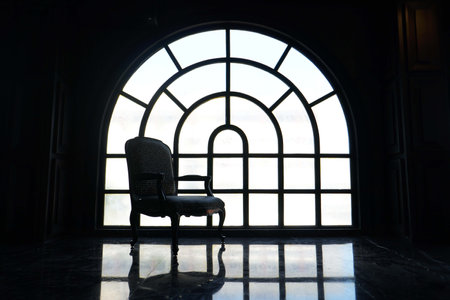 Front view of modern single chair in photo studio space against white light reflective window background. luxury minimalist roomの写真素材