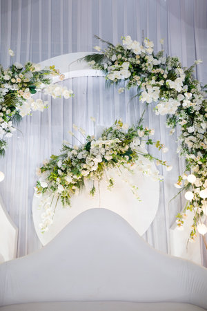 wedding decoration portrait wrapped in paper flowers, white cloth and white sofa closeupの写真素材