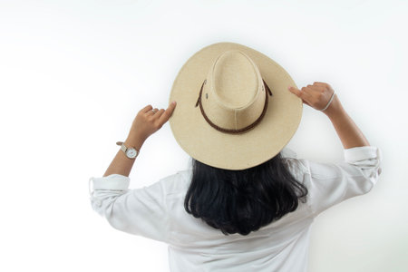 young asian indonesian woman with summer beach hat on freedom lifestyle back view isolated white background,の写真素材