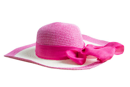 Beautiful straw hat with pink ribbon and circular white stripe at the end, beach hat, women's accessories, side view, clipping path on whiteの写真素材