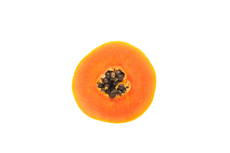 Half cut and whole papaya fruits on white backgroundの写真素材