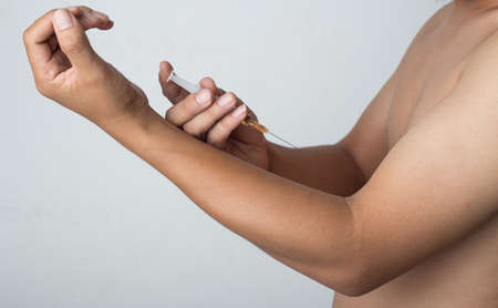 ManInjected into the armの写真素材