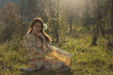 japanese kimono beautiful woman  on sakura garden.の写真素材